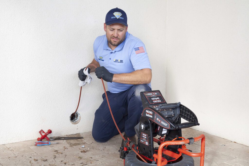 Rooter Ranger Plumber Working on Site
