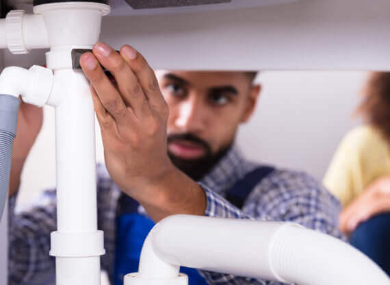 A skilled plumber is carrying out repairs in Phoenix, Arizona