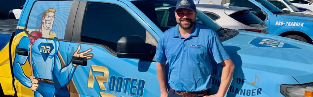 Rooter Ranger Staff Member Standing Near a Service Truck